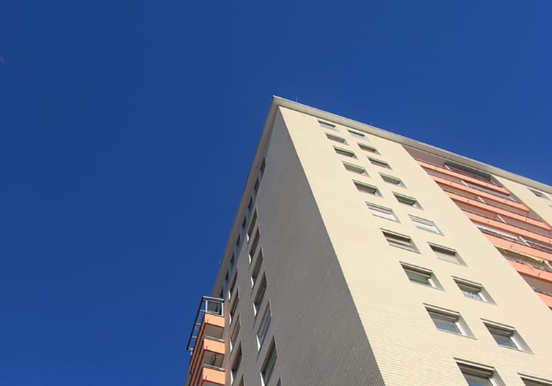 State- or local-funded tenant-based rental assistance (looking up at an apartment building)