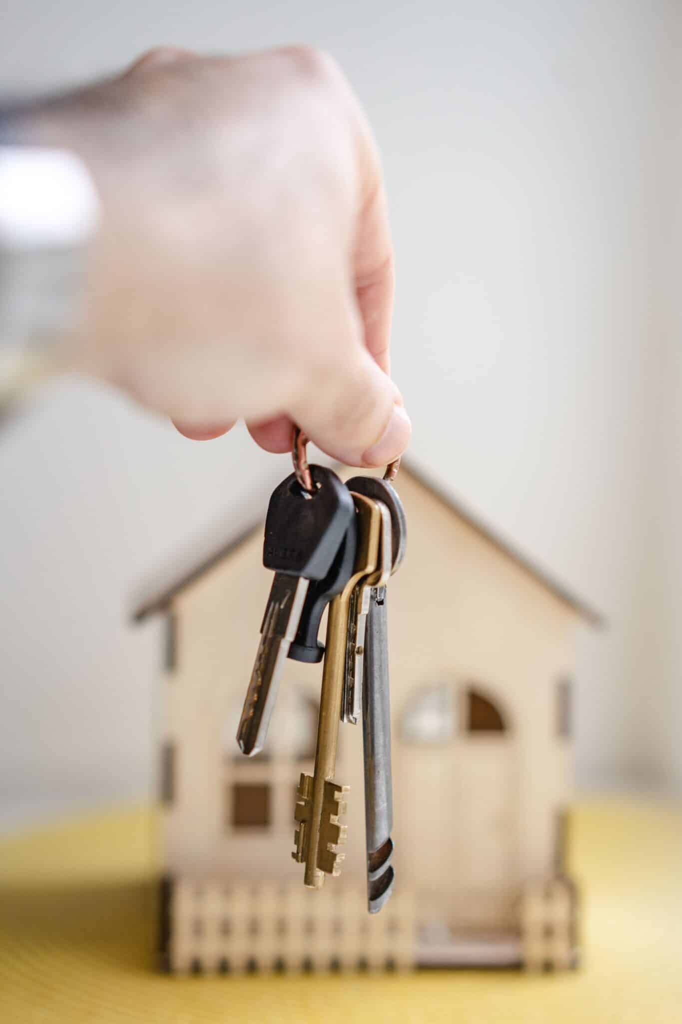 keys dangled in front of house
