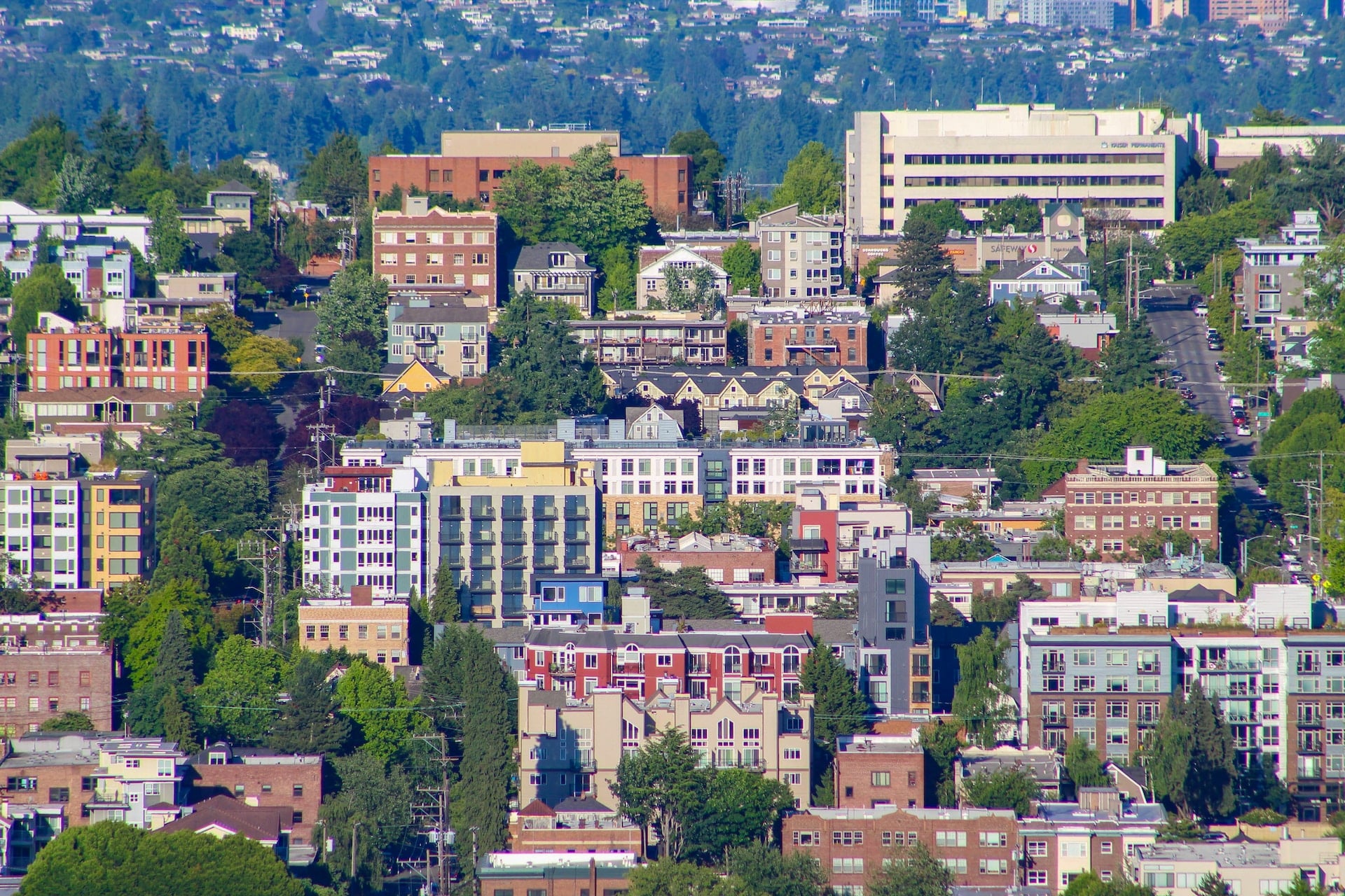 Image of a neighborhood with trees and green spaces illustrates how housing can contribute to health