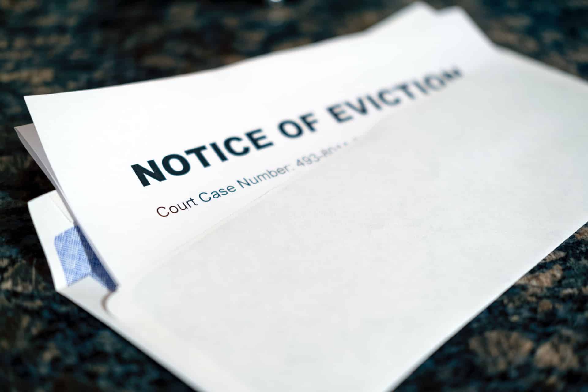 Photo of notice of eviction is shown to illustrate eviction prevention strategies