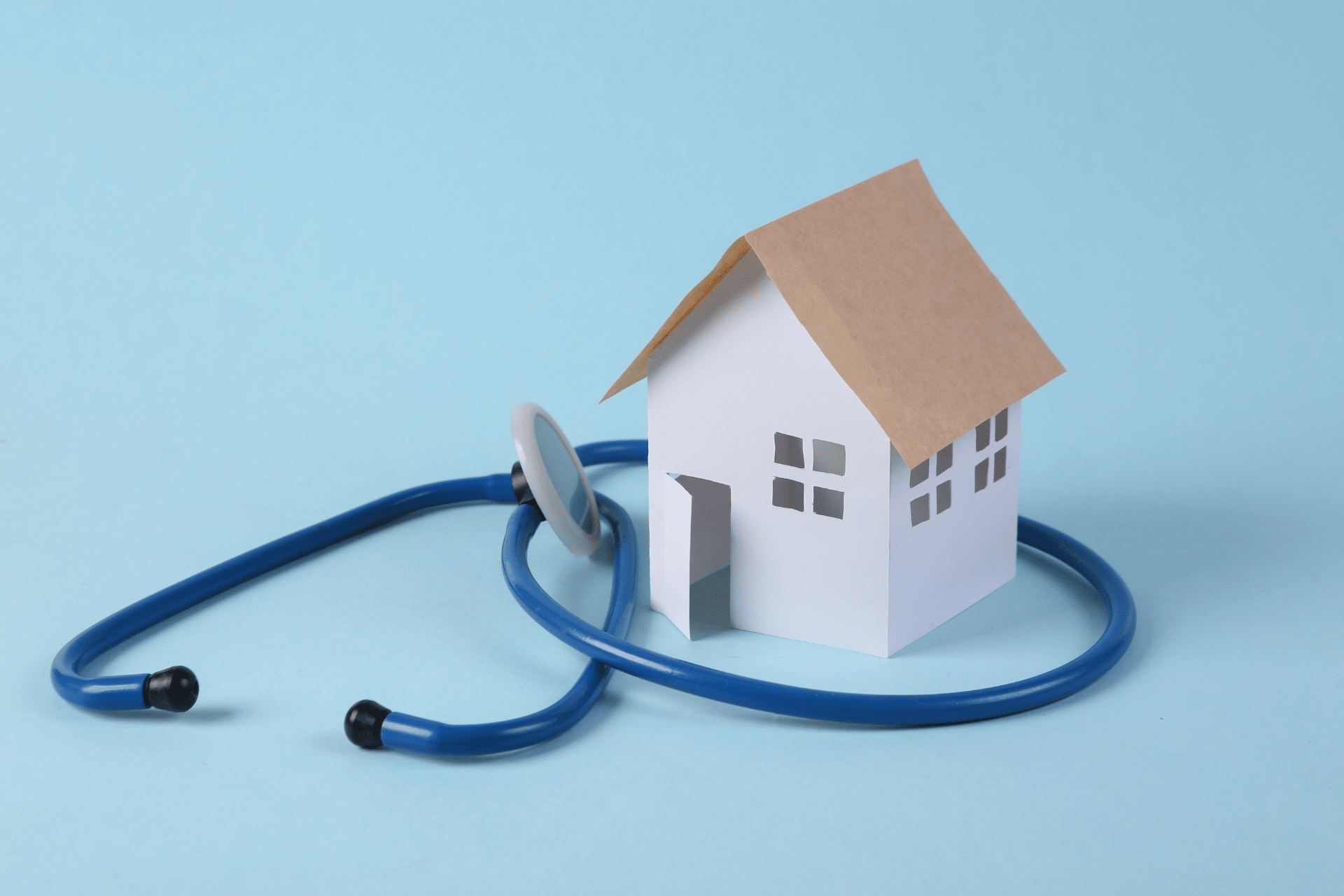 House and stethoscope are shown to illustrate housing and health connections