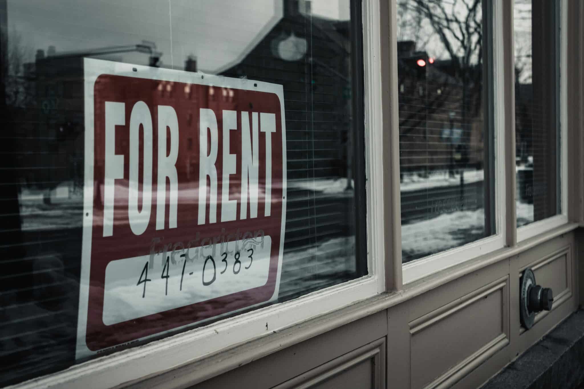 "For Rent" sign is shown to illustrate rental vacancy rates