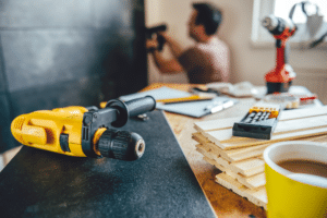 Home repairs are illustrated via powertools to advertise our Home Repair Peer Network Expression of Interest