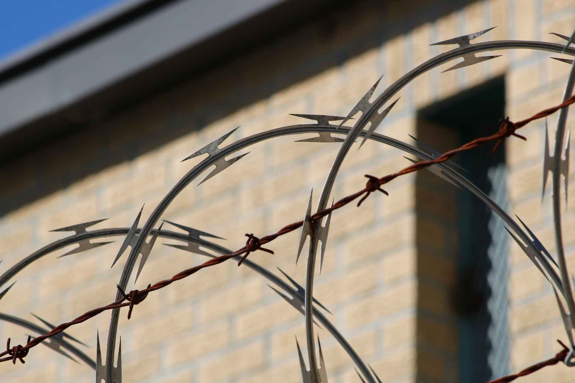 Image of barbed wire used to illustrate the incarceration and homelessness cycle